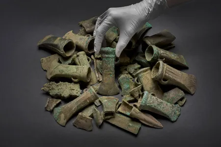The hoard includes 453 bronze objects, including axe heads, spearheads, sword fragments and bracelets