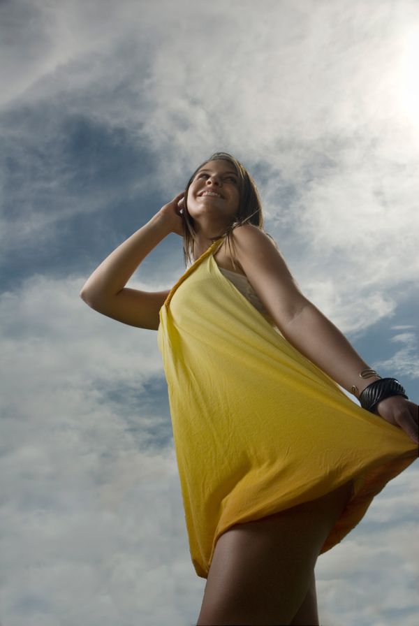 A woman poses in a sun dress thumbnail
