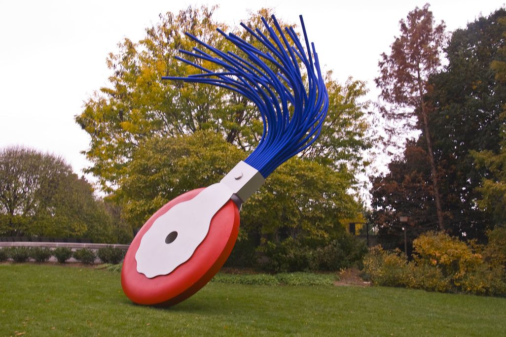 Red and blue sculpture of typewriter eraser