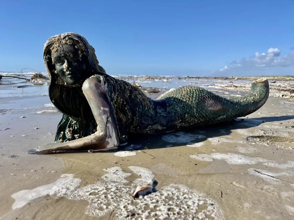 Fiberglass mermaid on the beach