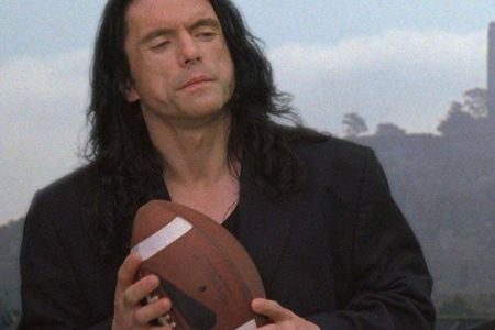 Tommy Wiseau clutches a football in ‘The Room,’ the 2003 film he wrote, produced and starred in.