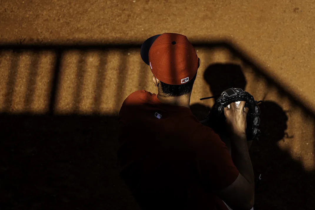 a baseball player warms up