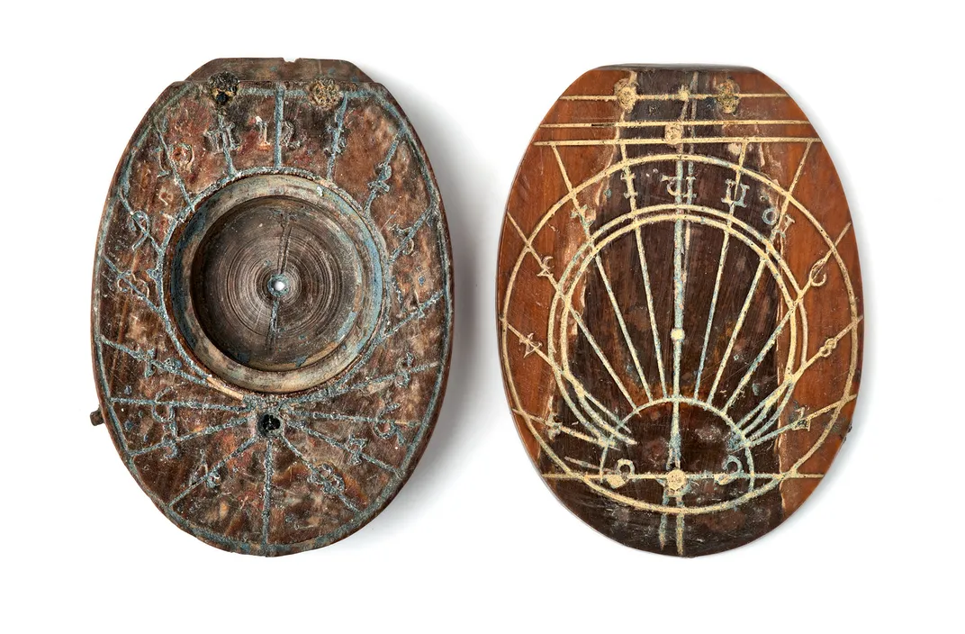 Two halves of ivory sundial