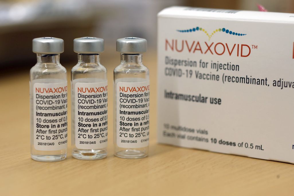 Three vials of the Novavax Covid-19 vaccine sit on a table
