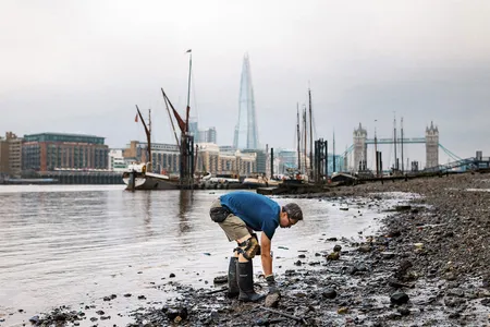 Jason Sandy mudlarking along the River Thames in London