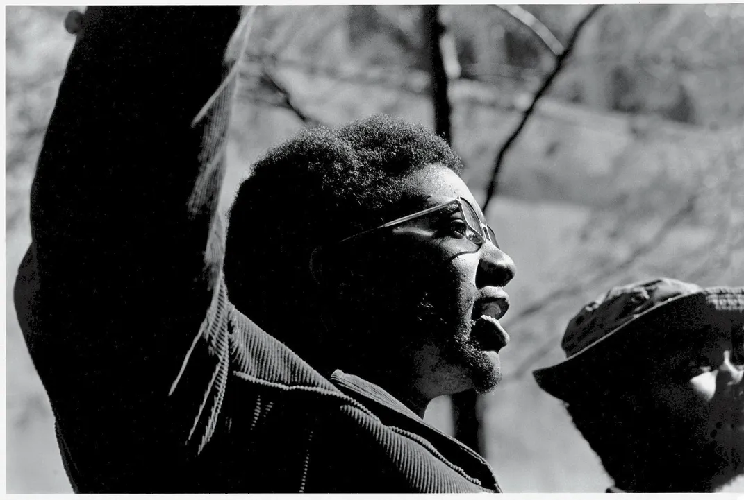 Fred Hampton raises his right hand at an October 11, 1969, rally in Chicago