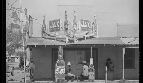 Black and white photograph of a the façade of a Mexican beer hall in Texas.