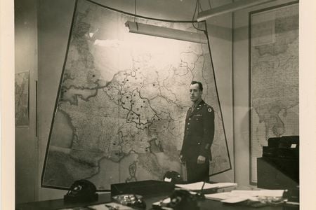 There are few images of the top-secret map room. This one, taken at the end of WWII, shows Army Chief Warrant Officer Albert Cornelius standing before a map of Europe.
