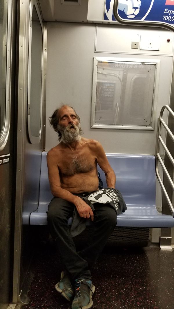 Man sleeping on Subway thumbnail