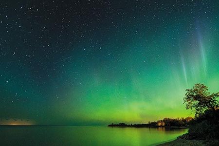 When a coronal mass ejection reaches Earth, solar particles stream along magnetic field lines, energize gases in the atmosphere and shine as norther lights.