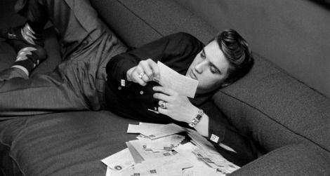 Elvis at 21: Presley reads fan mail on March 17, 1956