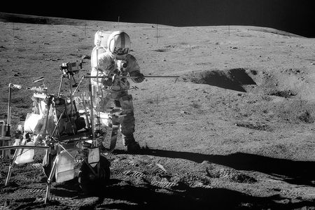 Apollo 14 Astronaut Alan B. Shepard Jr. assembles equipment on the lunar surface on February 6, 1971. 