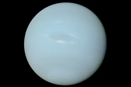 A photo of Neptune, taken by the Voyager 2 probe, with the colors rebalanced to represent its truest appearance