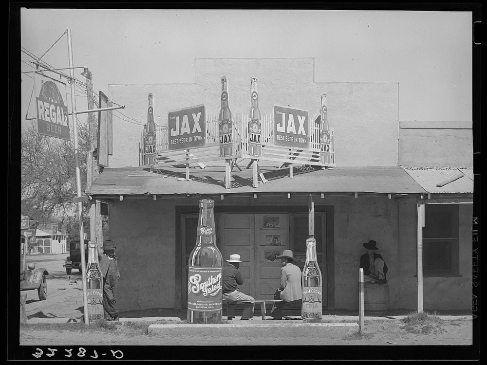 Black and white photograph of a the façade of a Mexican beer hall in Texas.
