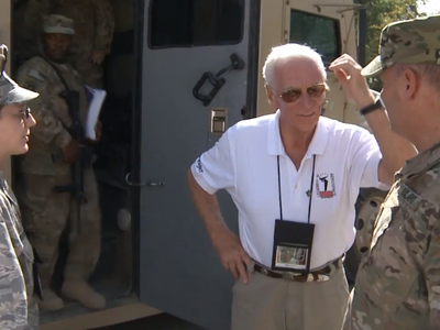 Apollo astronauts travel to meet U.S. soldiers in Afghanistan. 