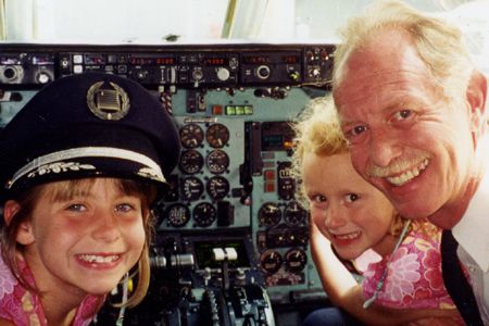 Sullenberger inside an MD-80 in 2001, with daughters Kate (left) and Kelly.