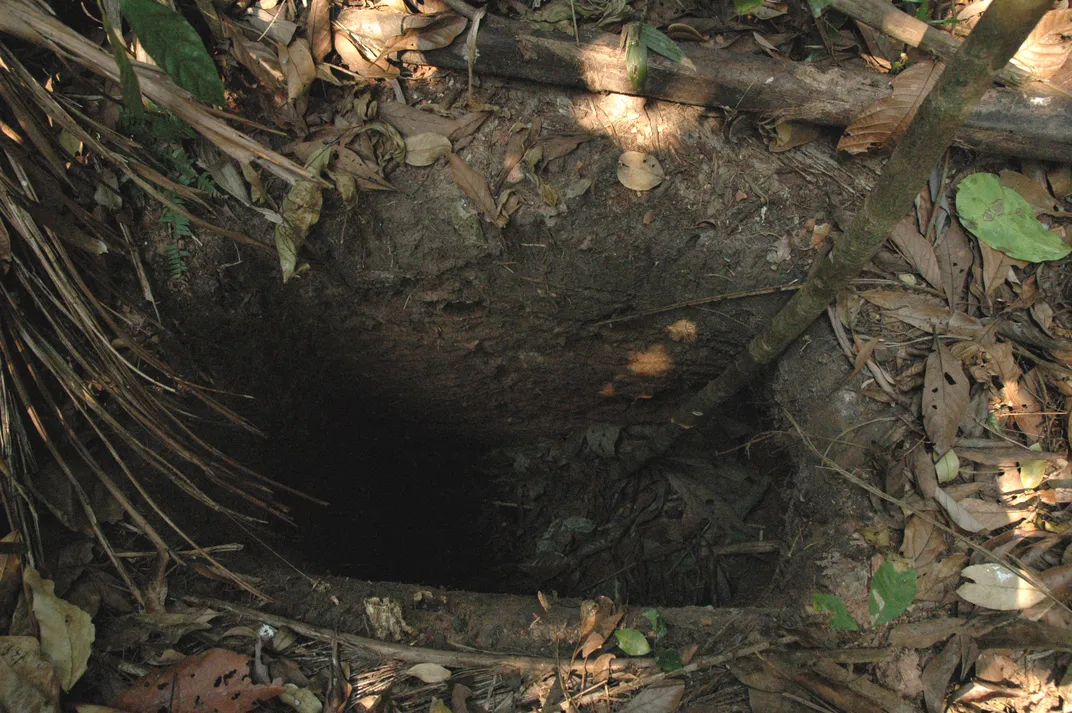 One of the holes the man dug inside the huts