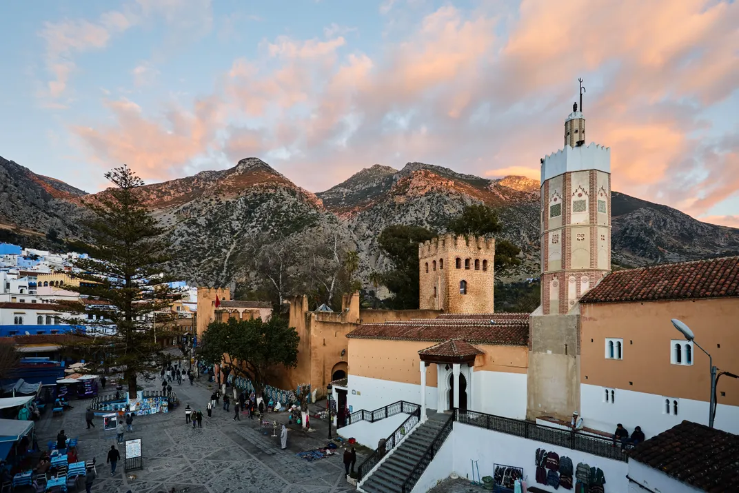 A mosque in Chefchaouen, Morocco, backed by the Rif Mountains