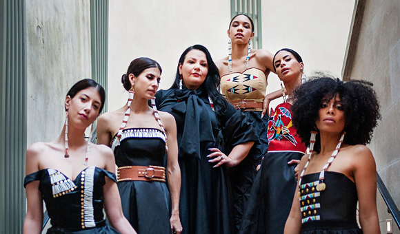 Norma Baker–Flying Horse (third from left) with models wearing her Red Berry Woman designs. Paris Fashion Week, March 2019. (Ulla Couture Photography)