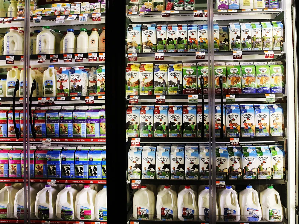 A refrigerator of milk in a grocery store