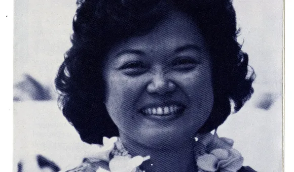 Patsy T. Mink wears a lei and smiles