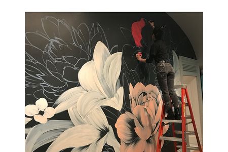 The artist Louise Jones, known as Ouizi, working on Adaptation Nocturne.