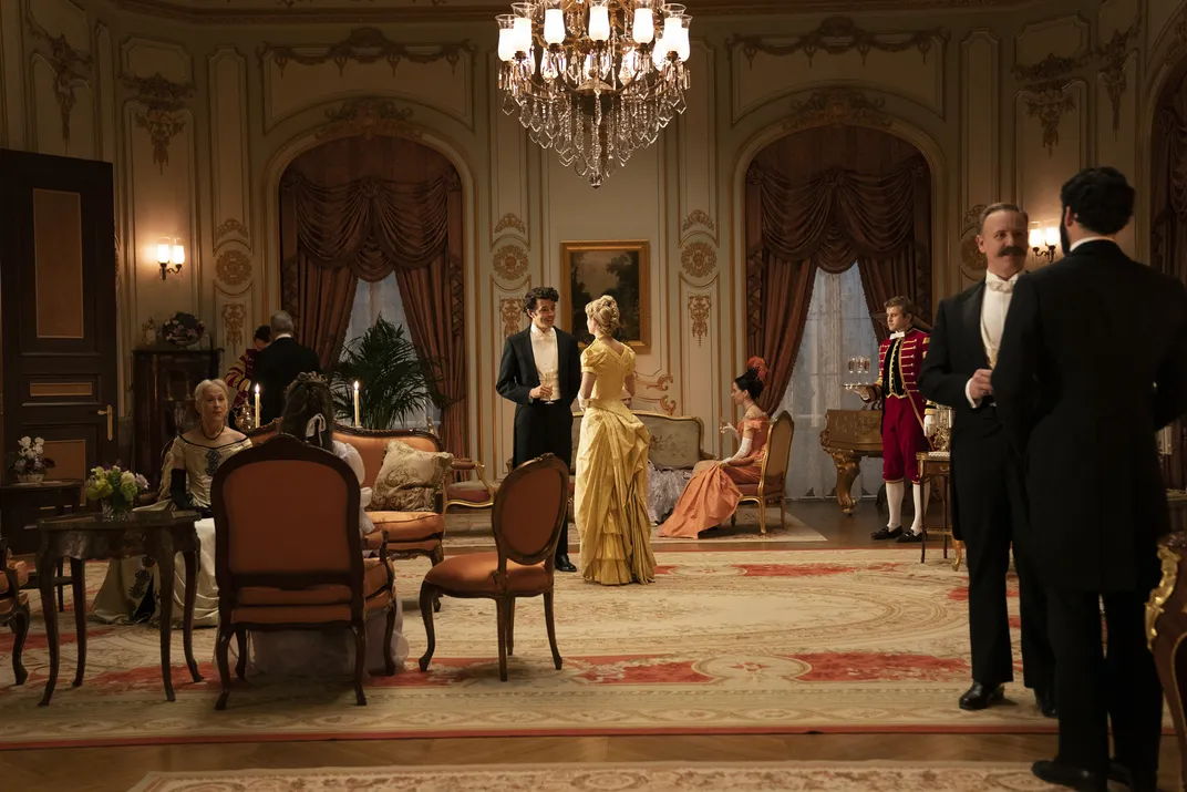 Harry Richardson and Louisa Jacobson stand in an ornate room in an episode of "The Gilded Age"