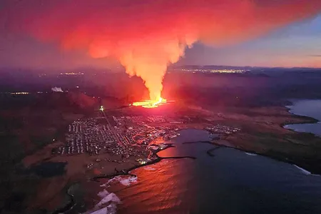A volcanic eruption moves toward the outskirts of the evacuated town of Grindavik on Iceland&rsquo;s Reykjanes Peninsula.