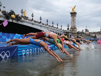 After delays and months of uncertainty, triathletes finally took the plunge into the Seine River in Paris.