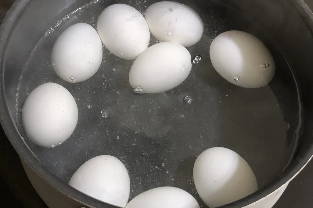 hard boiled eggs in hot water.