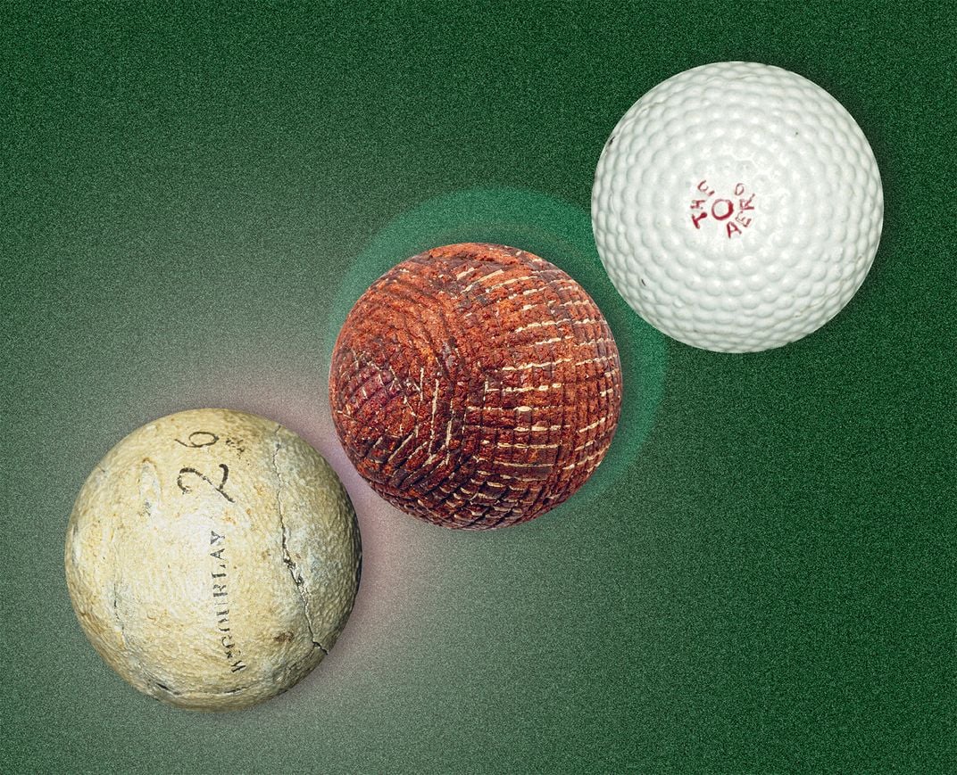 three different colored golf balls