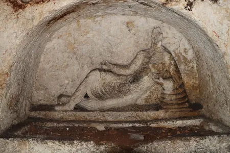The tomb&rsquo;s centerpiece carving depicts a reclining man.