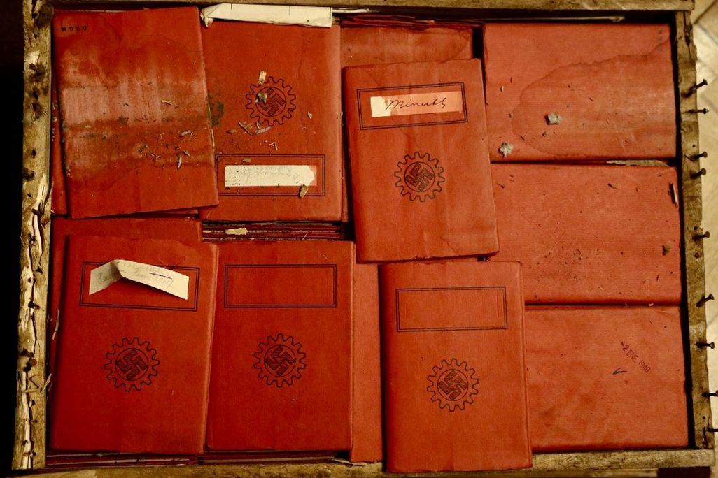 Red notebooks with swastika stamps