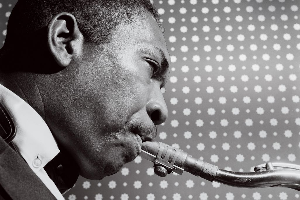 a portrait of a man playing the saxaphone