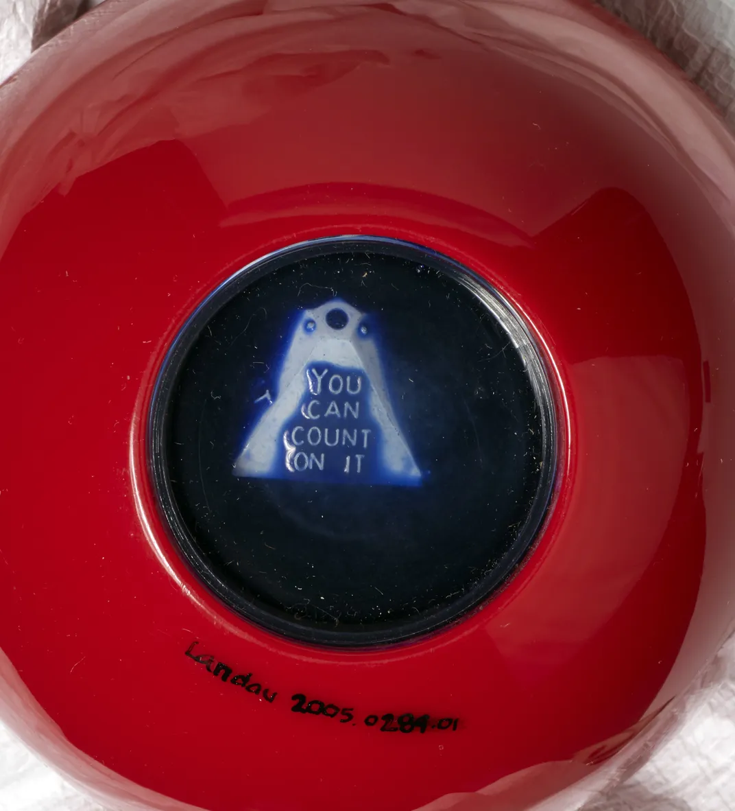 Close up of the bottom of a Magic 8 Ball Reveals "You can count on it"