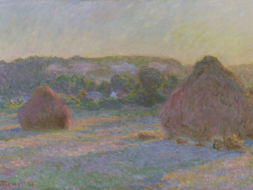 A pinkish field in bluish-yellow light, with one small wheat stack on the left and a larger one, round with a conical top, on the right. It appears to be evening or morning. The stacks leave long purple shadows and the light is hazy