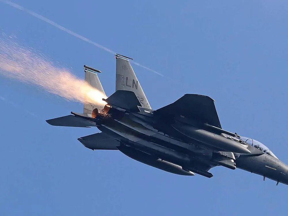 sparks trailing behind F-15E Strike Eagle