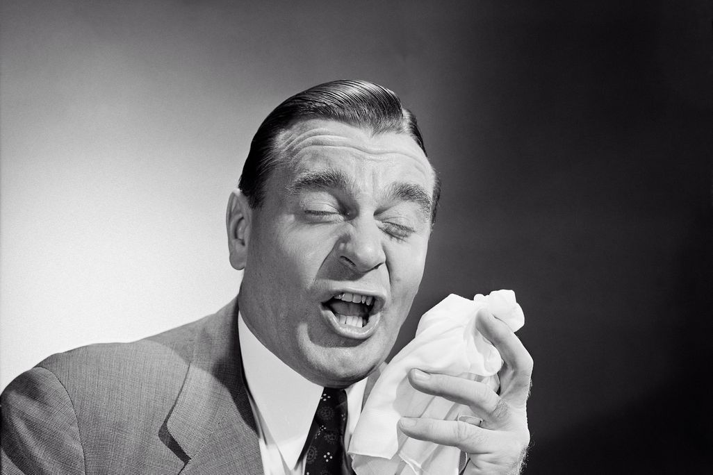 man sneezing