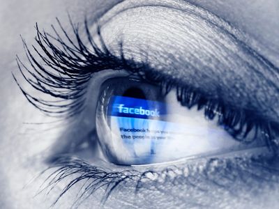 For now, visually impaired people must rely on captions like these for descriptions of the images on the internet. (This is a picture of an eye reflecting Facebook's home page). 