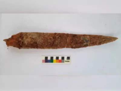 This iron dagger's well-preserved wooden handle may help researchers date artifacts found in Konthagai.
