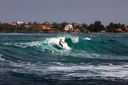 A surfer rides a wave during a competition in the Ngor district of Dakar, Senegal, the most westerly point of mainland Africa.