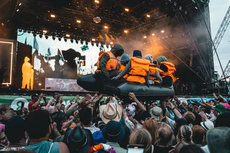 An inflatable raft appears to float through the crowd during&nbsp;Little Simz&#39;s performance at&nbsp;Glastonbury.
