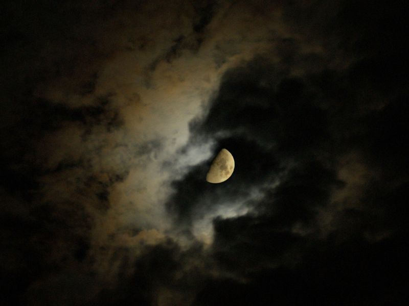 Beautiful moon hiding behind the clouds Smithsonian Photo Contest