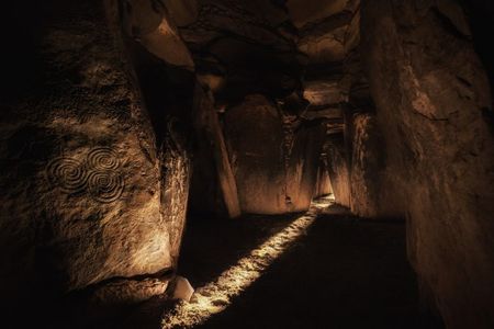 One of the interior passages of the 5,000-year-old Irish megalithic tomb of Newgrange. In this photo, sunlight enters the monument's main chamber at dawn on the winter solstice.

