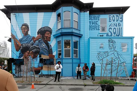 The mini museum is housed on the first floor of an Oakland, California, house whose exterior is decorated with a mural honoring the women of the Black Panther Party.