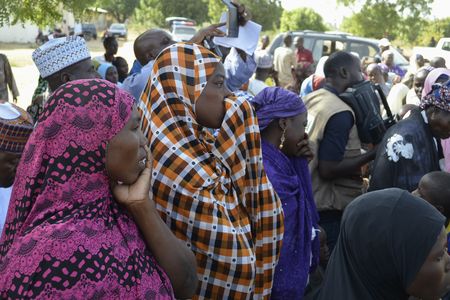 Parents of some of the kidnapped girls react during a meeting last Friday.