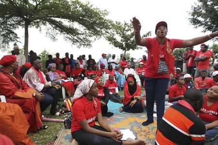 A 'Bring Back Our Girls' campaigner addresses supporters at the Unity Fountain, on the 100th day of the abductions of more than 200 school girls by the Boko Haram, in Abuja on July 23, 2014.