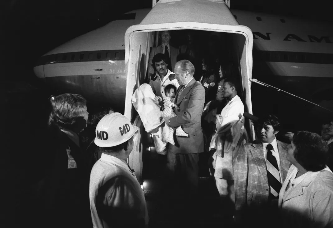 President Gerald Ford holding a baby evacuated from Vietnam during Operation Babylift