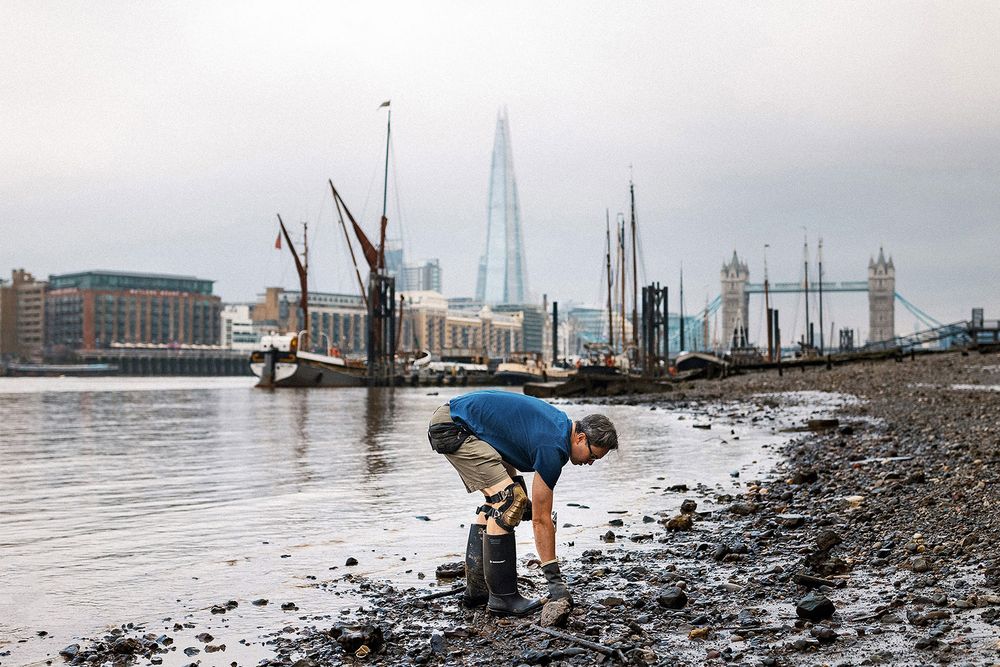 Jason Sandy mudlarking along the River Thames in London