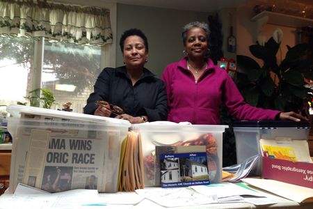 Mills (left) and Buck (right) use painstakingly gathered documents to spread knowledge of local black history.